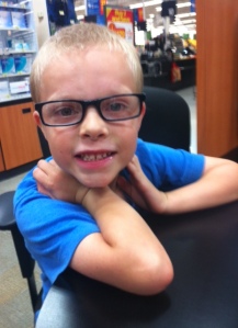 14.  My son getting his first pair of glasses.